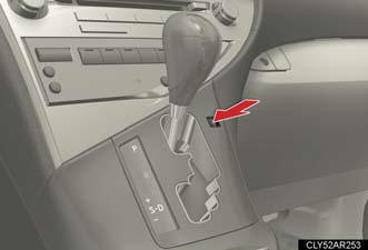 Press the shift lock override button.