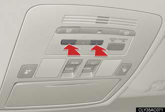 Press and hold the 2 outside buttons