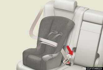 Run the seat belt through the child